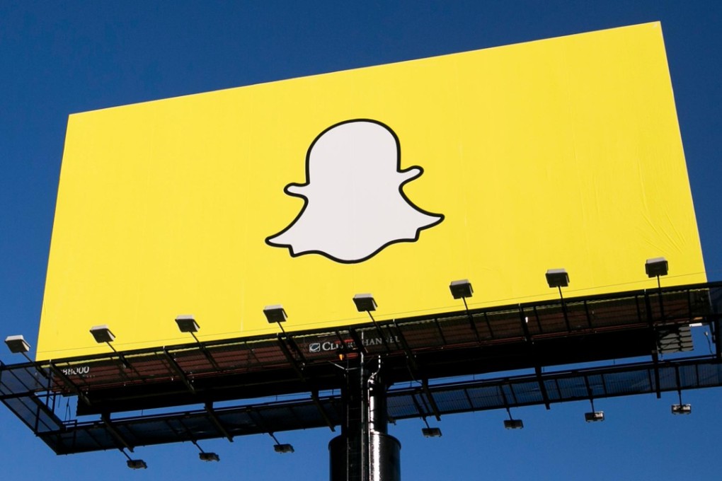 An advertising billboard featuring the Snapchat logo. The brand has undergone a complete redesign. Photo: Alamy
