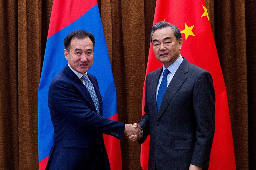 China's Foreign Minister Wang Yi (right) made his comments after meeting the Mongolian Foreign Minister Damdin Tsogtbaatar in Beijing. Photo: Reuters
