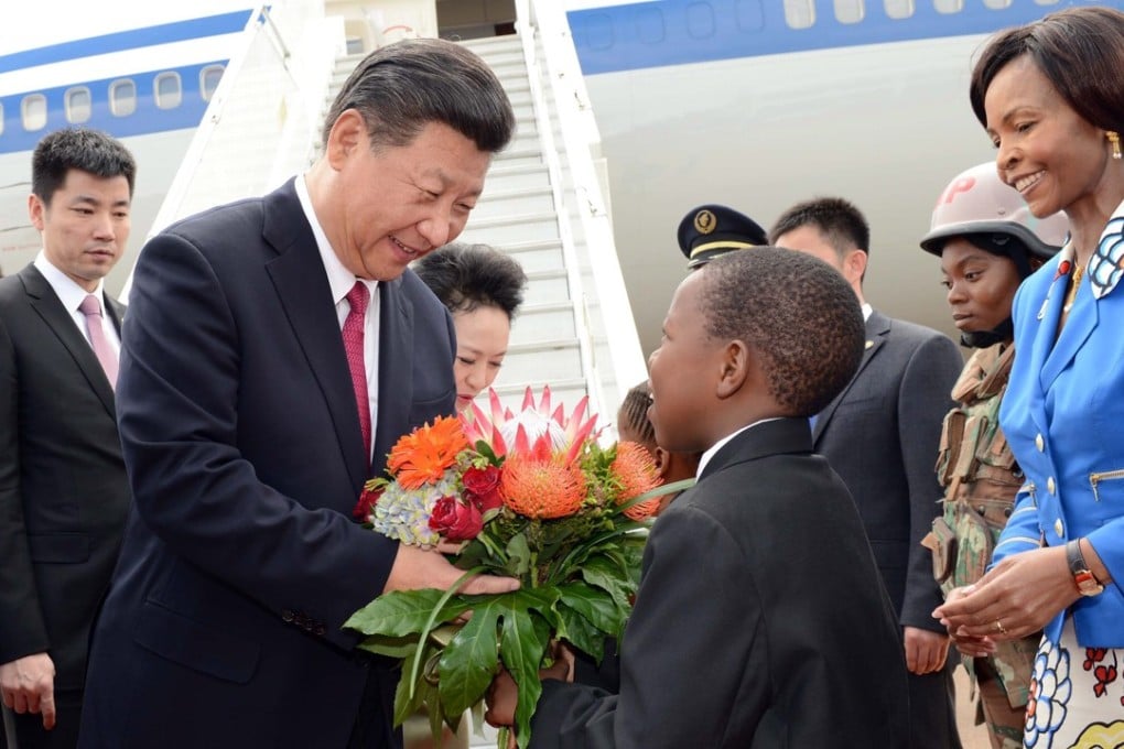 Chinese President Xi Jinping is greeted upon his arrival at Waterkloof Air Force Base in Pretoria, South Africa, in December 2015. Photo: EPA