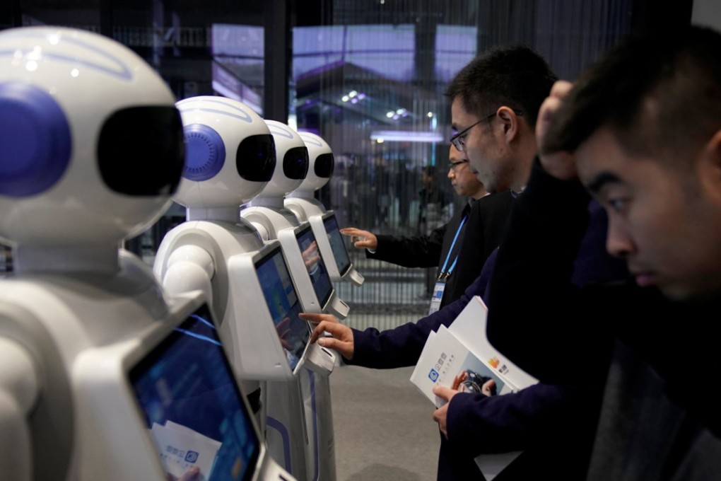 People look at robots at the fourth World Internet Conference in Wuzhen, eastern China. A report published at the event said China’s internet industry was second only to that of the US. Photo: Reuters