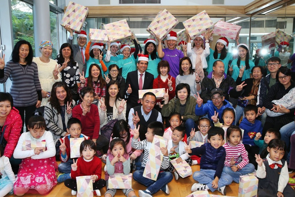 Credit Suisse volunteers host a Christmas party at a cancer support facility in Tuen Mun. Photo: K.Y. Cheng