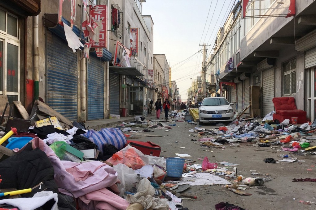 Discarded items are seen on a street after residents were required to move out of the area due to a citywide fire safety inspection prompted by a deadly fire in an apartment block, at Xinjiancun in Daxing district, Beijing. Photo: Reuters