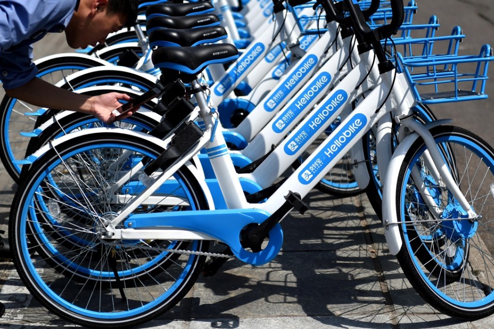 Hellobike bicycles on a street in Luoyang city, in China’s Henan province. Funds raised by the provider recently have led to speculation about renewed competition in the bicycle-sharing industry. Photo: Imaginechina
