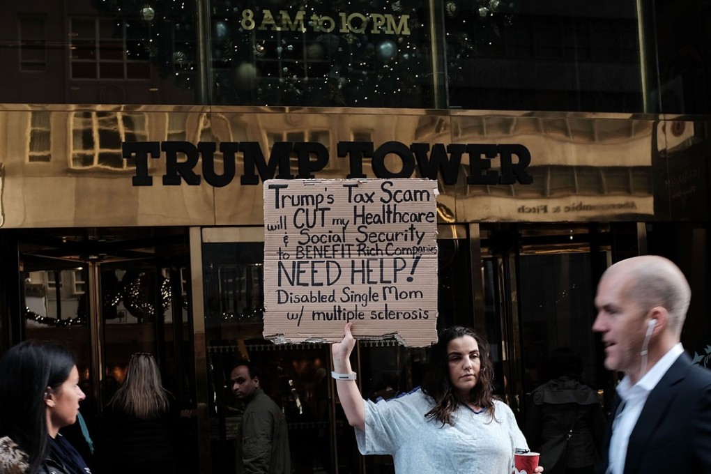 Rosary Solimanto, who has multiple sclerosis and fears for her finances, holds a protest outside Trump Tower over the Republican administration's proposed tax cut which many economists predict will benefit the wealthy at the expense of the poor and middle class. Photo: AFP