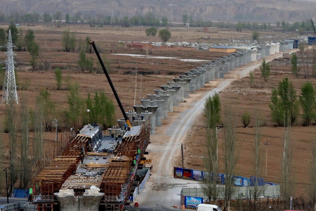 China’s fixed-asset investment in infrastructure will grow 12 per cent next year, according to a Bloomberg survey. Photo: Xinhua