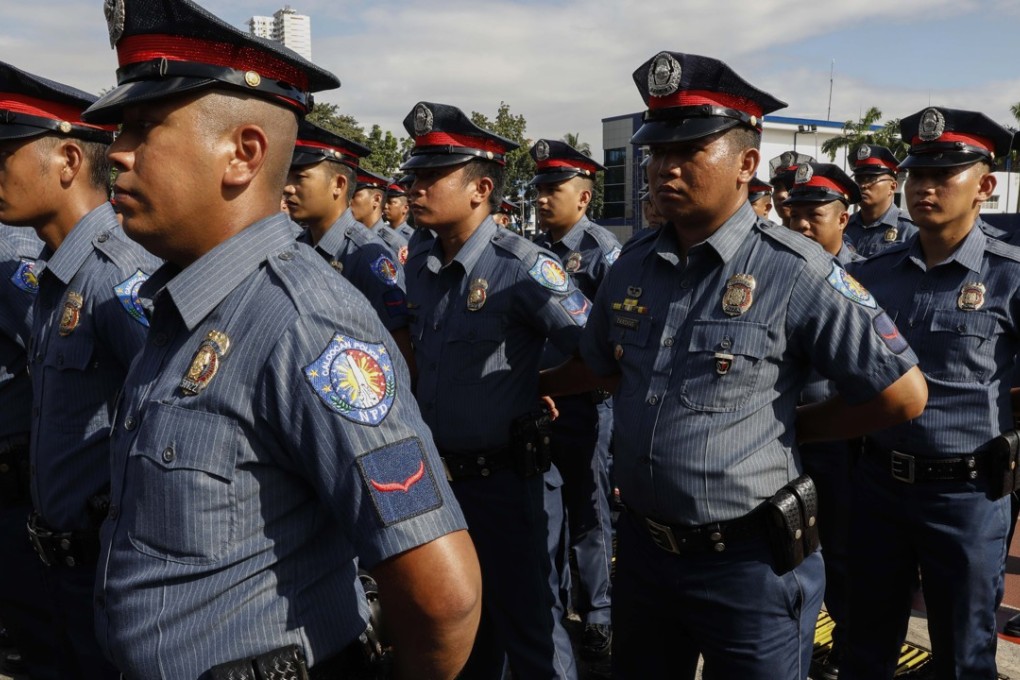 Police officers who underwent a retraining and reorientation programme as part of internal cleansing efforts of the Philippine National Police. Photo: EPA