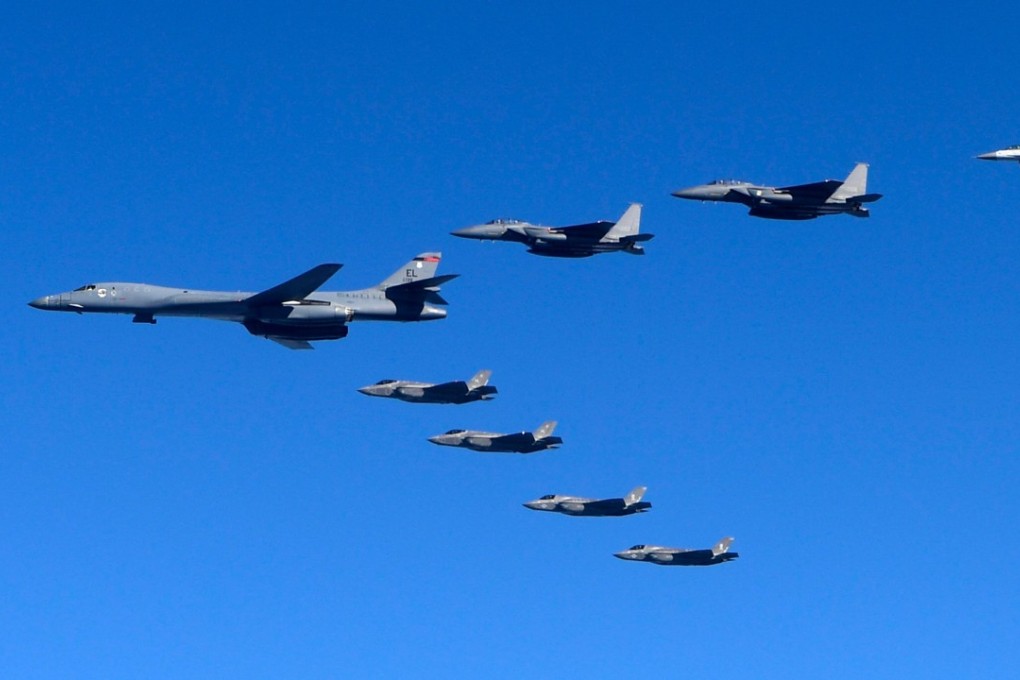 A US Air Force B-1B Lancer bomber flies over South Korea with South Korean and US fighter jets. Photo: AP