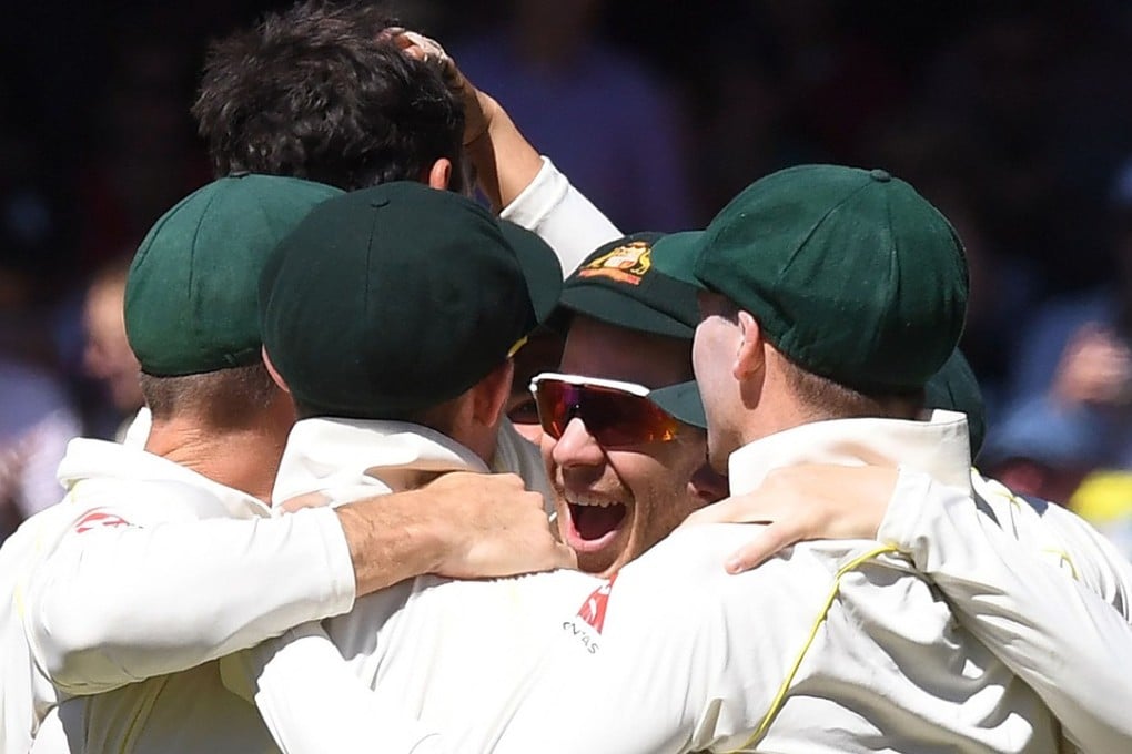 Australia’s players celebrating after they defeated England on the final day of the second Ashes test in Adelaide. Photo: AFP