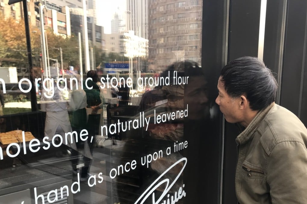 About 300 people were queuing outside the Starbucks Reserve Roastery at mid morning during its debut on Wednesday. Photo: Reuters