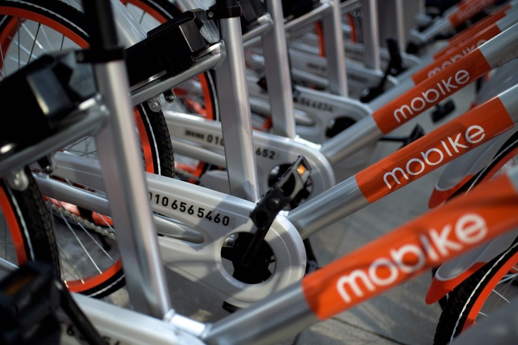 Mobike shared bicycles on a street in Beijing. The head of Mobike wants a clearer regulatory framework in which to operate in China. Photo; AFP