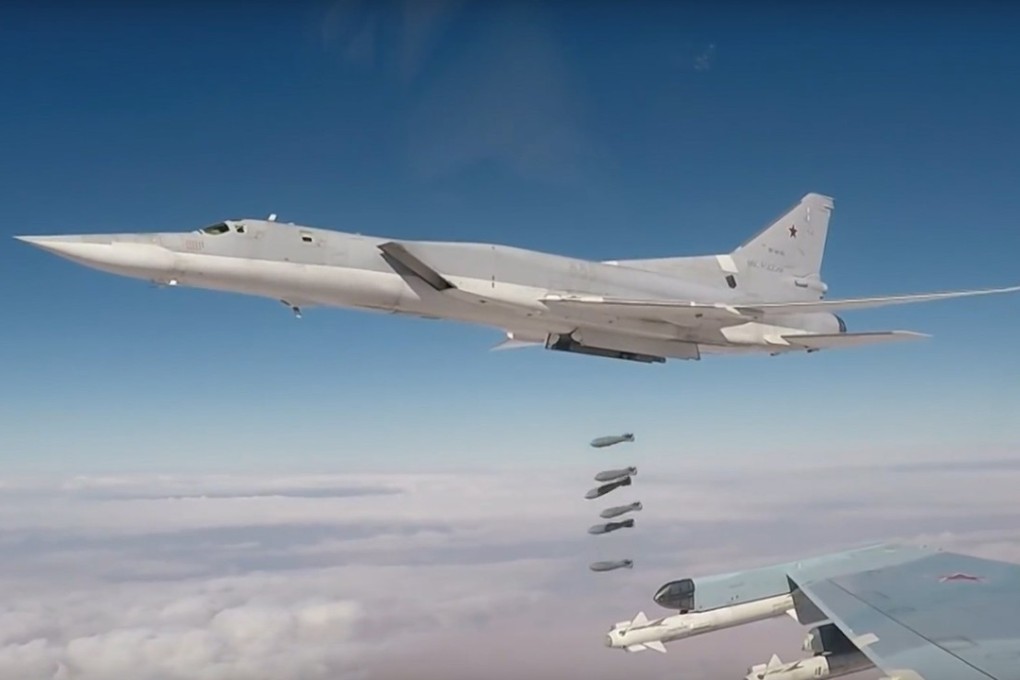 A handout still image from the Russian Defence Ministry shows a Russian TU-22M3 long-range strategic bomber, deployed from an airbase in Russia's territory, dropping bombs targeting Islamic State in Syria. Photo: EPA-EFE