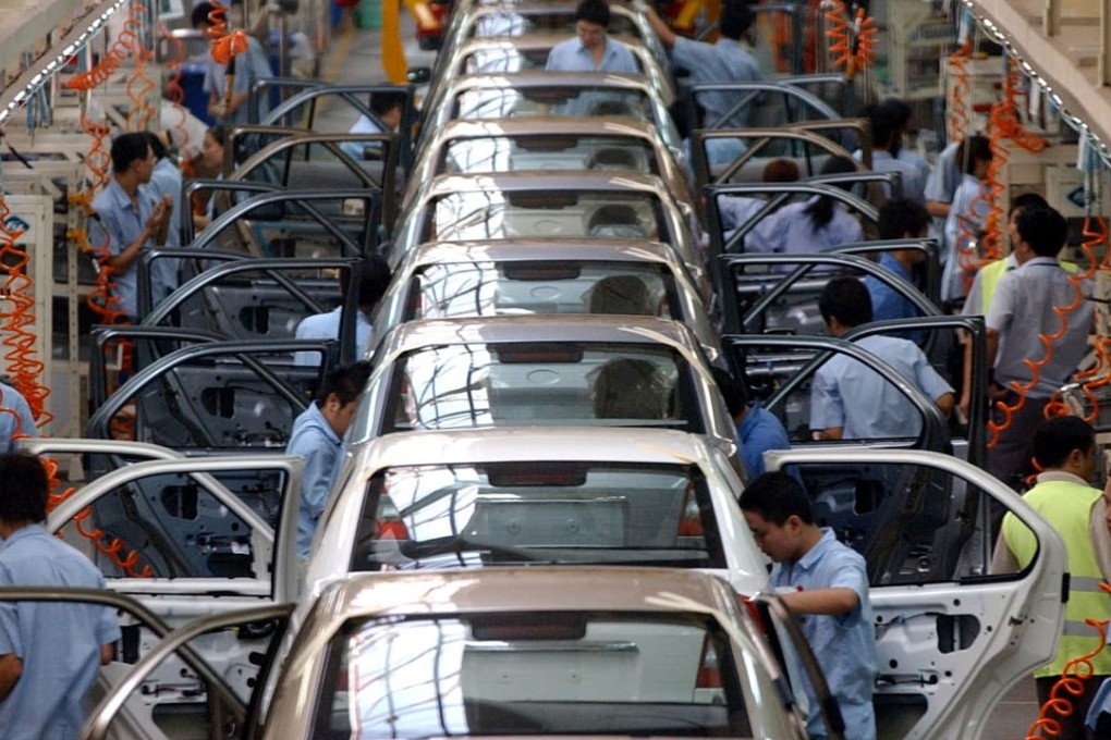 Chinese workers on the assembly line of a Ford Motor plant in Chongqing. Photo: AP
