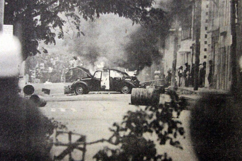 A car burns on Court Street during the Bermuda riots of 1977. Photo: Handout