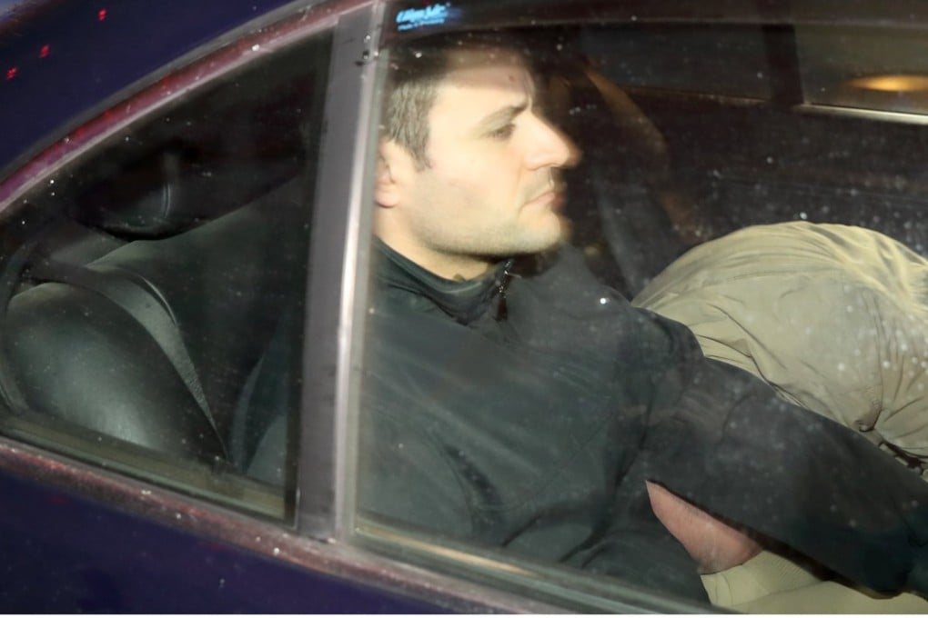 One of the three suspects (right, obscured) charged with the murder of Maltese journalist Daphne Caruana Galizia arrives at court in Valletta on Tuesday. Photo: EPA
