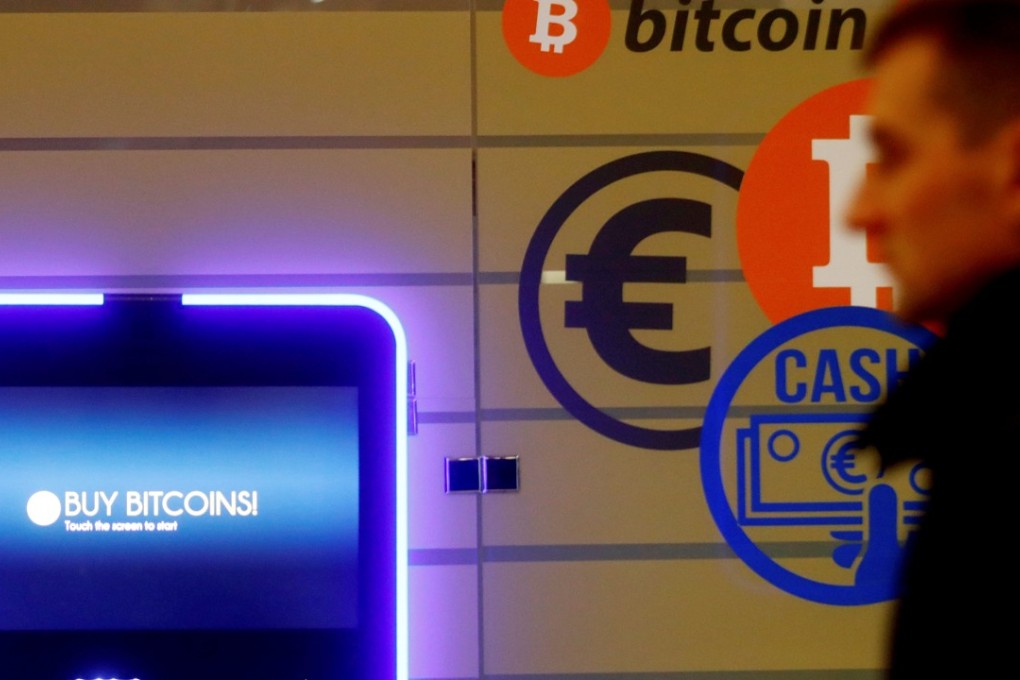 A man walks past a bitcoin ATM as the cryptocurrency raced to a record above US$13,000, sparking fears of a dangerous bubble. Photo: Reuters
