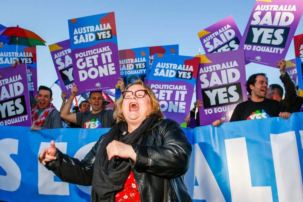 Supporters of same-sex marriage celebrate in front of Parliament House in Canberra. Photo: AFP