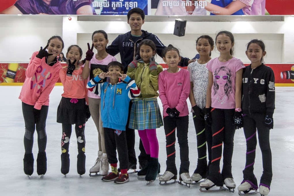 Sen Bunthoeurn, who competed at the Southeast Asian Games, with some of the young skaters he coaches in Phnom Penh.
