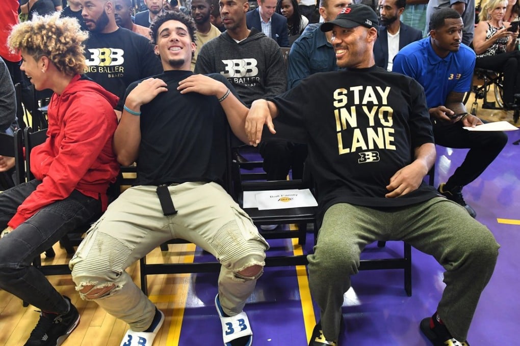 LaVar Ball sits with his other sons LaMelo (L) and LiAngelo (C) as the Los Angeles Lakers hold a news conference introducing the Lakers' first-round draft pick Lonzo Ball. Photo: TNS