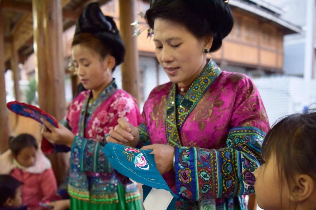 Women of the Miao ethnic group work on embroidery in southwest China’s Guizhou province, on December 1. Increasing the economic opportunities for women seems a natural way to increase development opportunities around the world, if discrimination can be overcome. Photo: Xinhua
