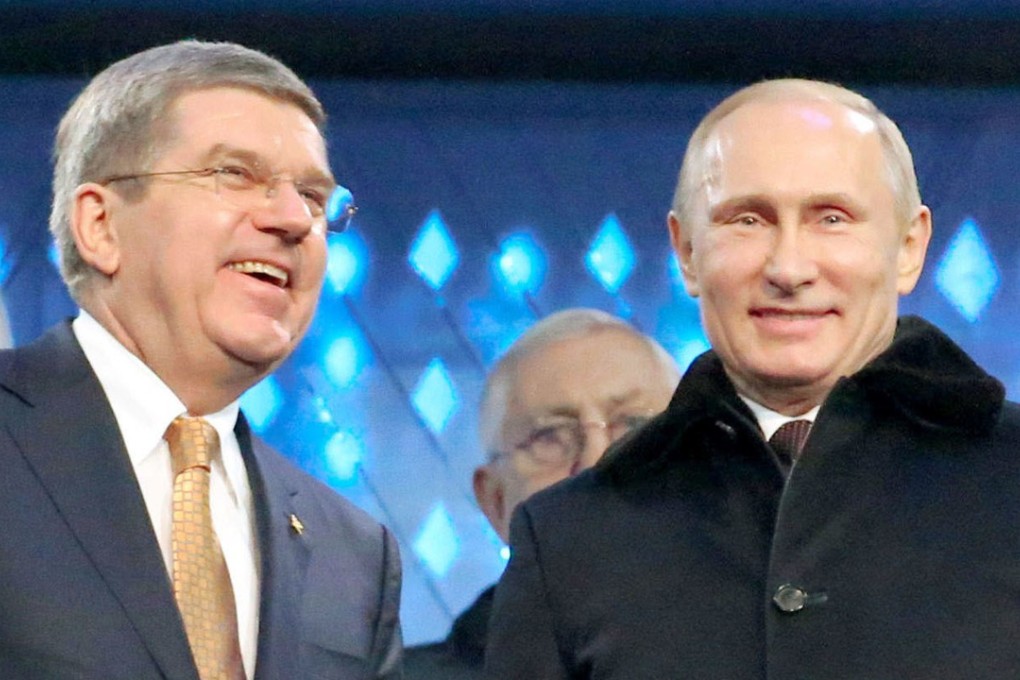 IOC president Thomas Bach (left) and Russian President Vladimir Putin at 2014 Winter Olympics opening ceremony in Sochi. Photo: Kyodo