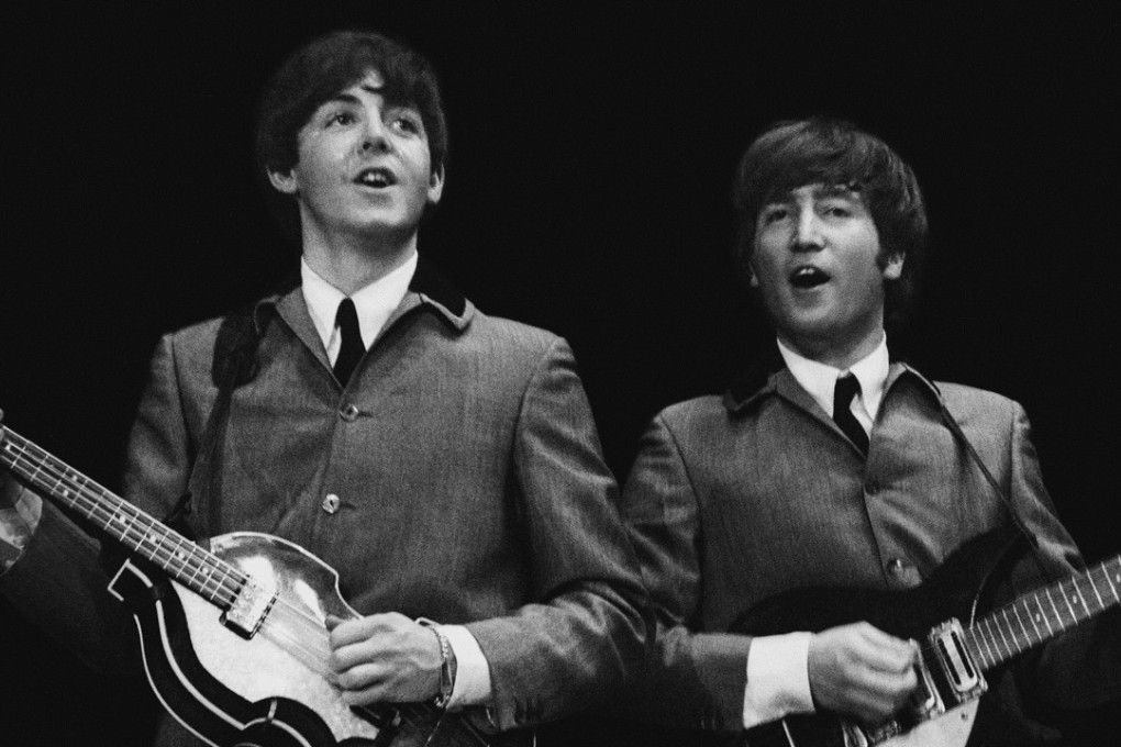 John Lennon (right) performs with Pail McCartney during the Beatles’ first US concert, on February 11, 1964. Picture: AP