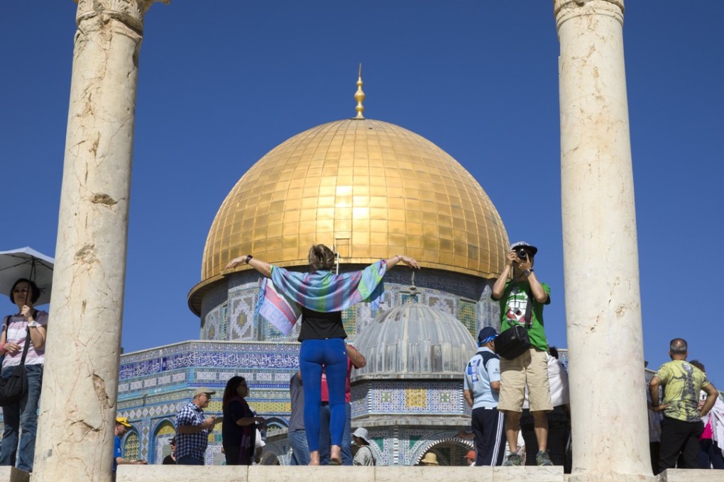 Tourists reach Jerusalem’s Dome of the Rock during a visit to a site that is sacred to both Muslims and Jews. Photo: EPA