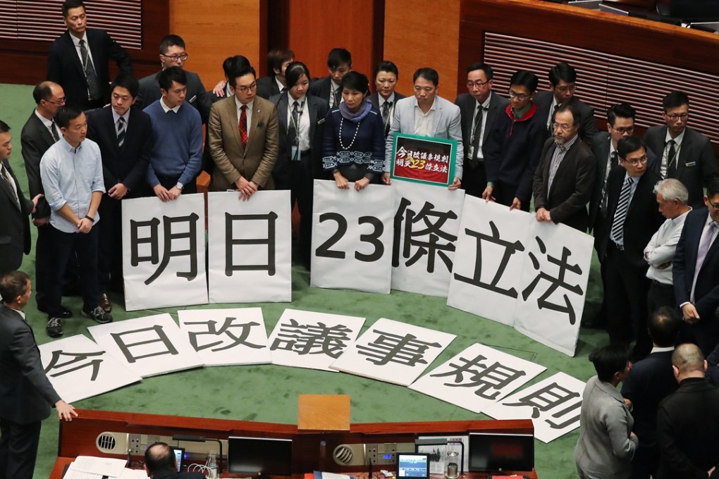 The protesting lawmakers expressed fears that national security legislation could more easily be forced through the chamber with the rule changes. Photo: K. Y. Cheng