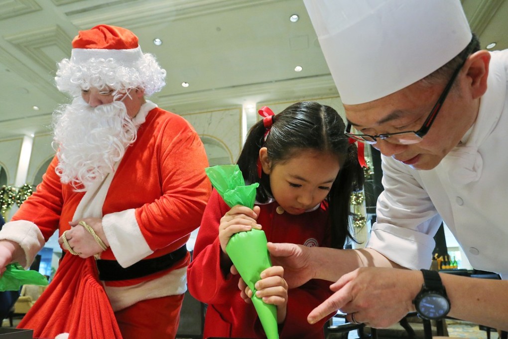 A Singapore International School pupil and Kowloon Shangri-La’s Wins Hung in Tsim Sha Tsui East. Photo: Dickson Lee