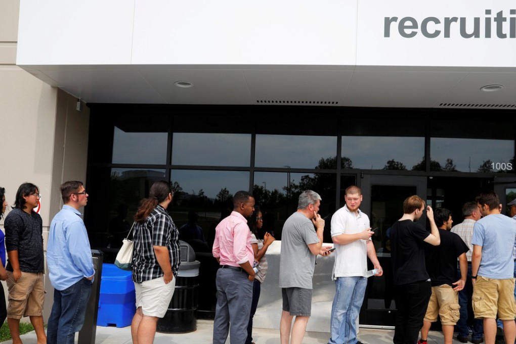 Jobseekers line up to apply during “Amazon Jobs Day,” a job fair being held across the United States aimed at filling more than 50,000 jobs. Photo: Reuters