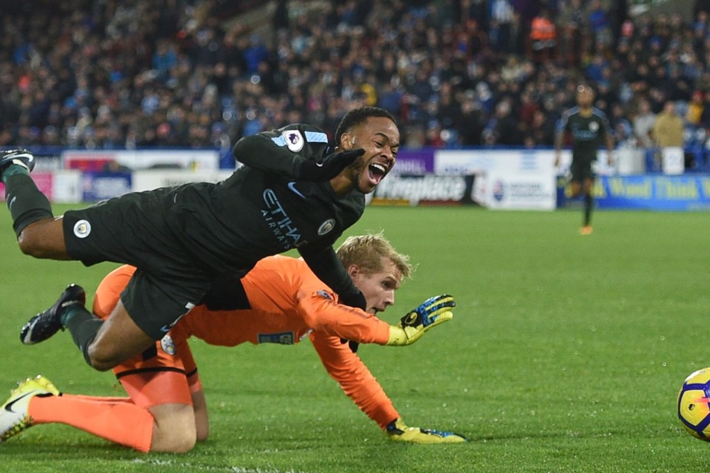 Manchester City’s Raheem Sterling fails to get a penalty after a clash with Huddersfield goalkeeper Jonas Lossl. Photo: AFP