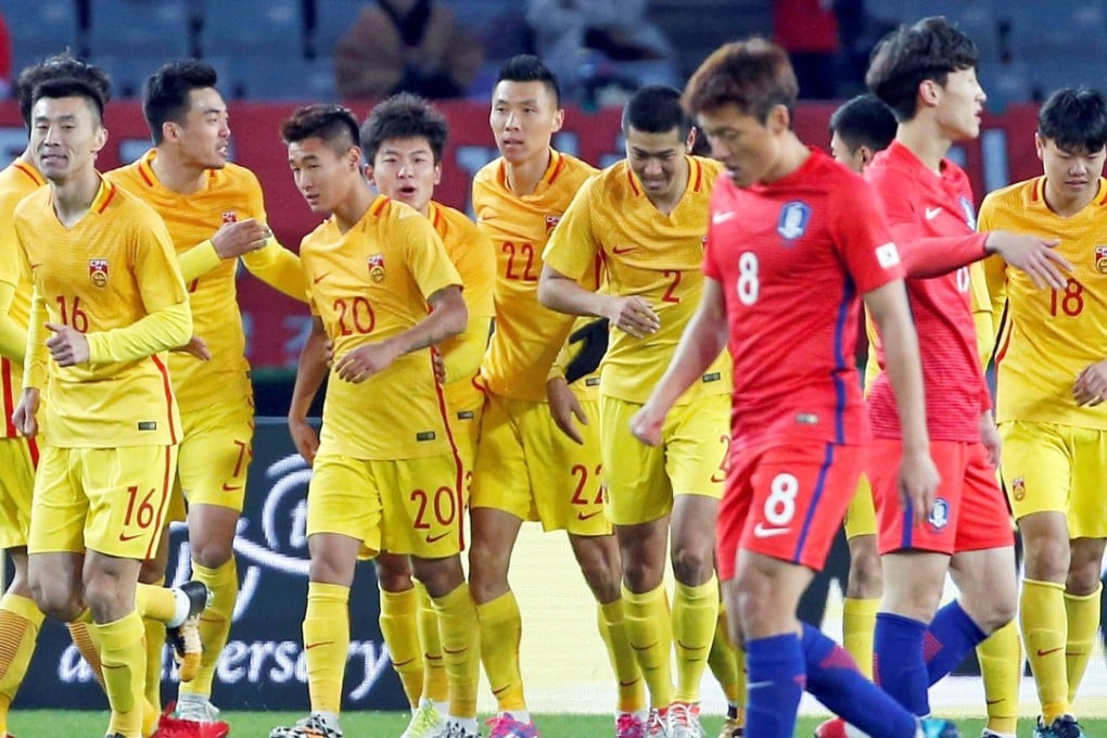 China's Wei Shihao (20) celebrates his goal with teammates in Tokyo. Photos: Reuters