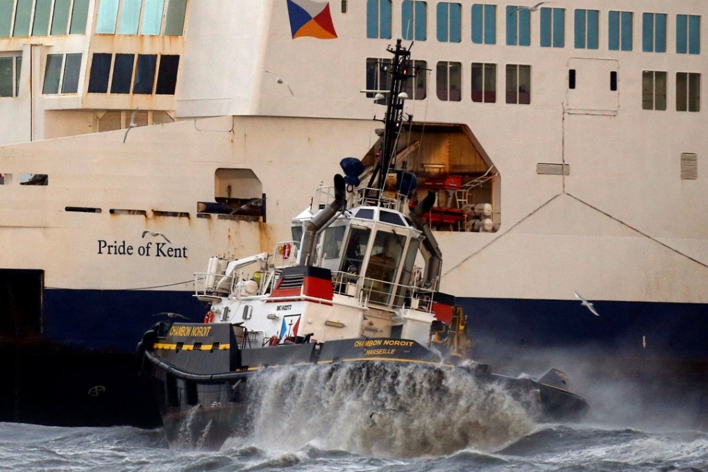 A tugboat manoeuvres the P&O ferry Pride of Kent after it ran aground during bad weather in the port of Calais in northern France, on December 10, 2017. Photo: Reuters