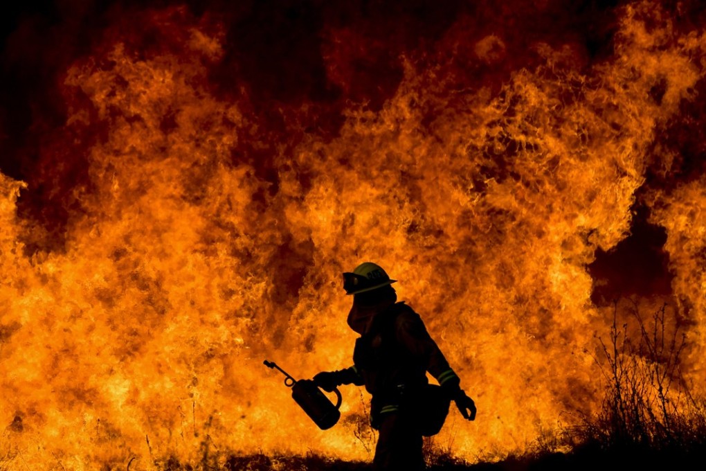Firefighters battled blazes around Ventura County, California. Photo: EPA