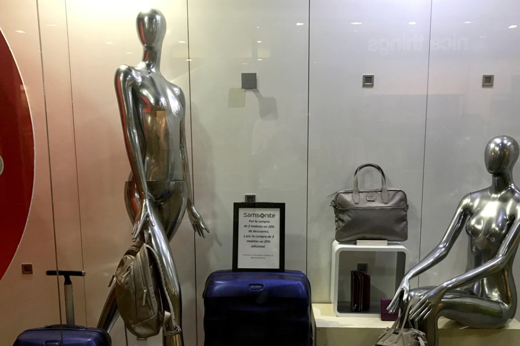 Samsonite suitcases displayed in a shop window in Las Rozas, Spain on August 3, 2017. Photo: Reuters