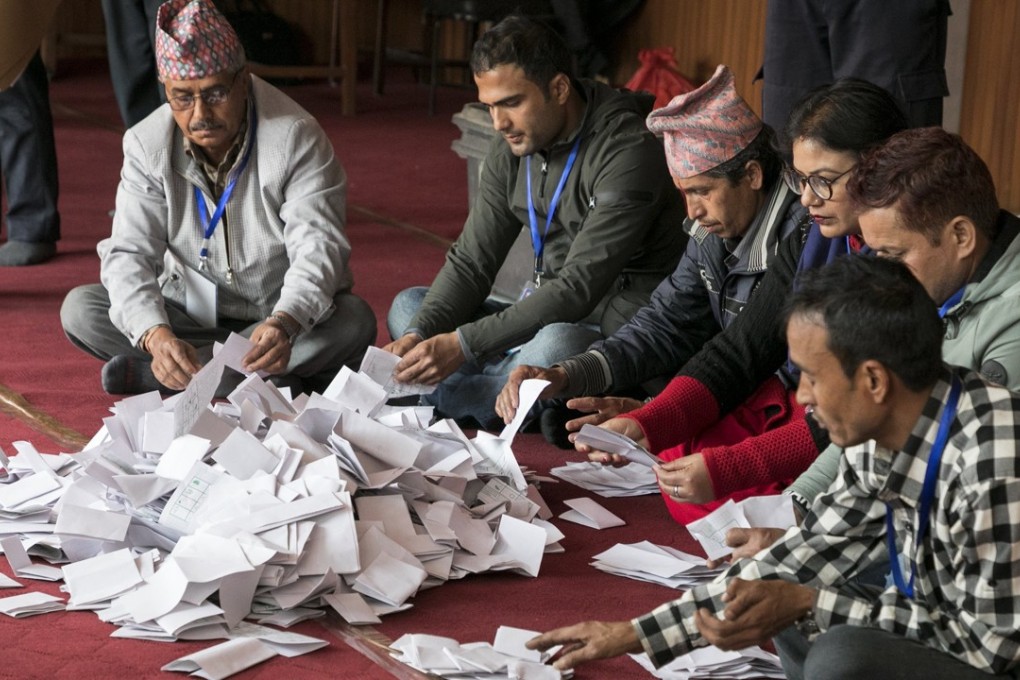 Nepalese officials of the Election Commission begin the counting of the votes. Photo: EPA