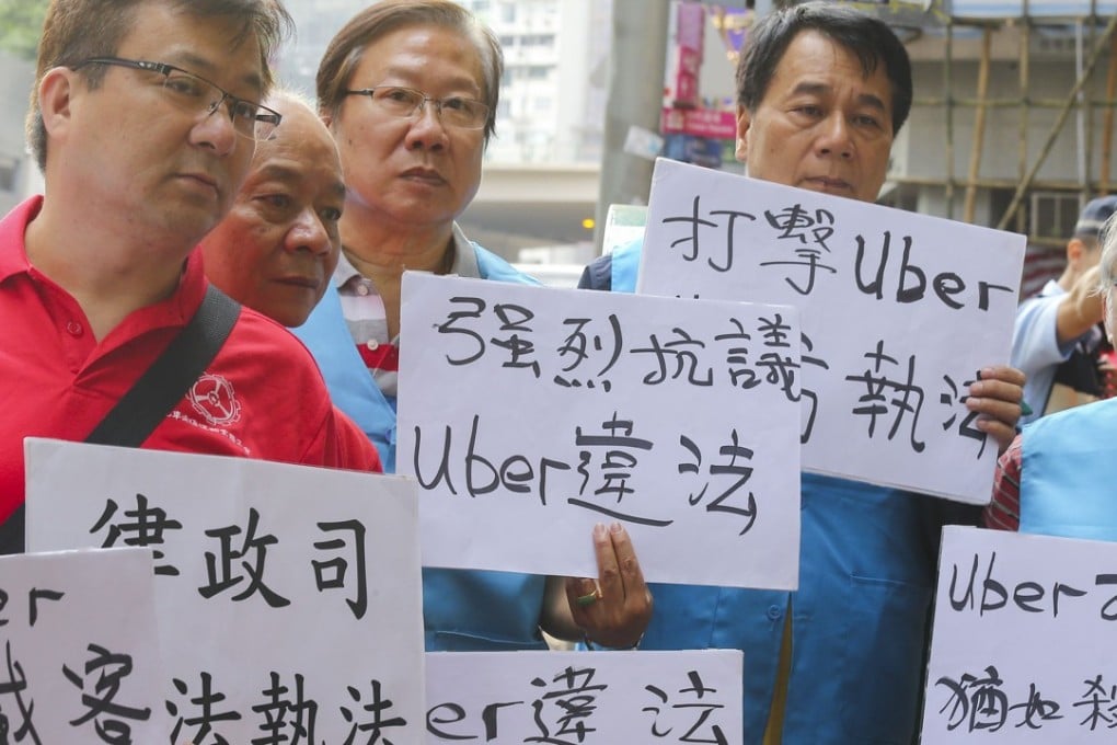 Hong Kong taxi drivers protest outside the Uber headquarters in Causeway Bay last month. Photo: Dickson Lee