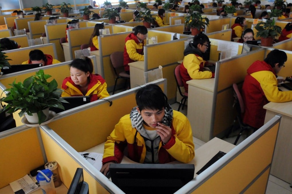 This picture taken on November 12, 2013 shows workers checking the deliveries at an express delivery company in Beijing. Chinese shoppers spent a record 35.0 billion yuan (USD5.7 billion) at the country's biggest online marketplaces Tmall and Taobao, the two shopping platforms of Chinese e-commerce giant Alibaba, on Singles' Day on November 11 – the festival created by e-tailers to persuade the loveless to console themselves with retail therapy – the state-run Economic Information Daily reported. Photo: Agence France-Presse