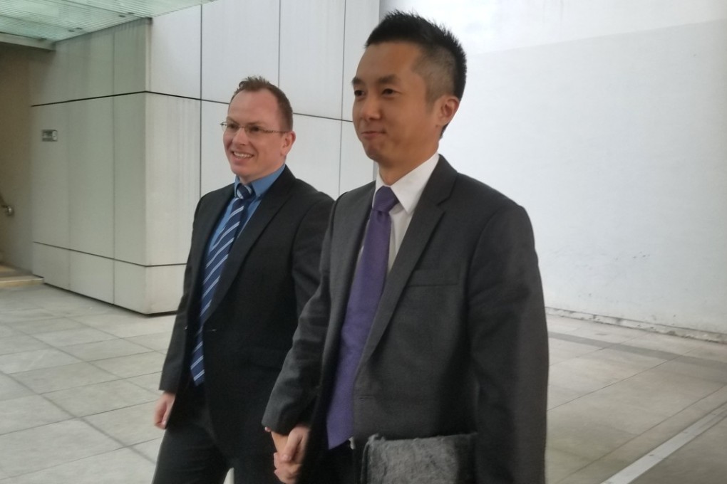 Scott Adams (left) accompanies his partner, senior Hong Kong immigration officer Angus Leung, at the High Court. Photo: Chris Lau