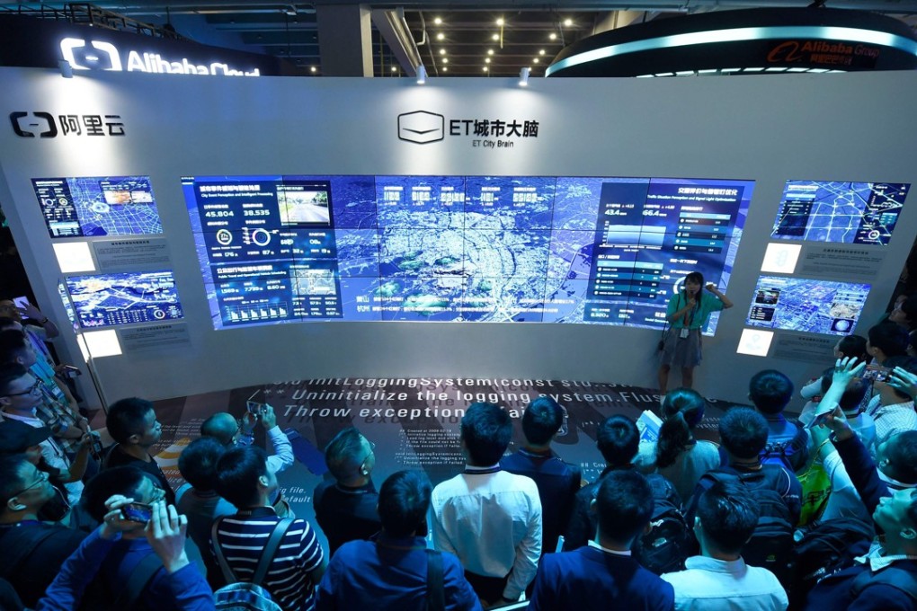 This October 11, 2017 photo shows visitors watching a visual logging system of city power data on the Computing Conference 2017 in Hangzhou. Photo: AFP