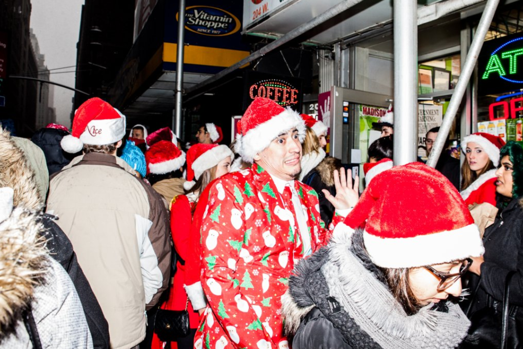 Santas wait in line to get into John Sullivan's during SantaCon. Photo: Sarah Jacobs/Business Insider