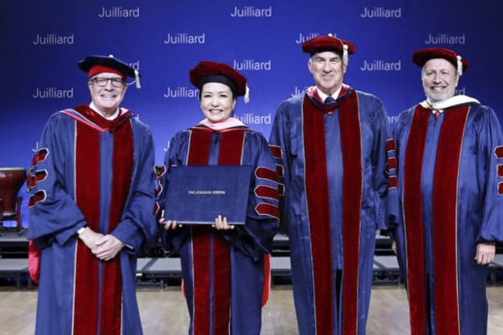 Peng Liyuan (2nd left), folk singing soprano and wife of Chinese President Xi Jinping, receives her honorary doctorate from New York’s Juilliard School at a ceremony in Beijing on December 6. Photo: China Conservatory of Music