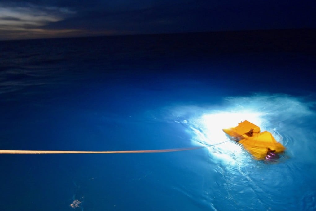 A handout photo made available by the US Navy shows the R/V Atlantis, a US Navy owned research vessel, deploying a cable-controlled Undersea Recovery Vehicle off the coast of Argentina on Saturday. Photo: EPA