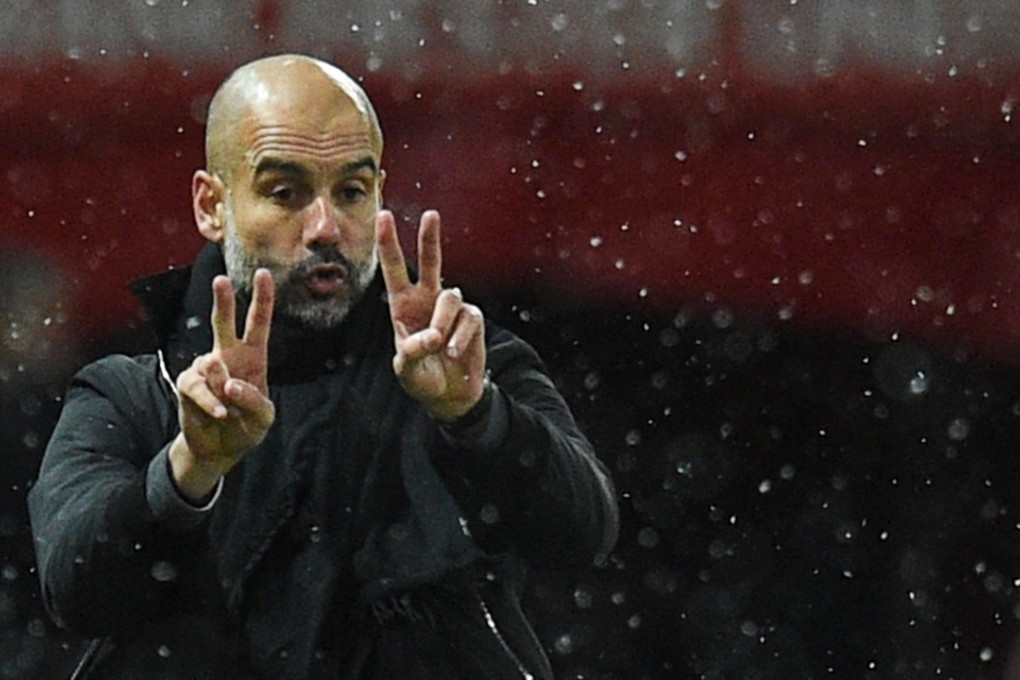Pep Guardiola gestures from the touchline at Old Trafford. Photo: AFP