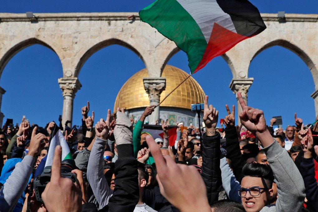 Palestinian Muslim worshippers shout slogans during Friday prayer at the al-Aqsa mosque compound in the Jerusalem's Old City on December 8. Israel deployed hundreds of additional police officers following Palestinian calls for protests after the main weekly Muslim prayers against President Trump's recognition of Jerusalem as Israel's capital. Photo: AFP