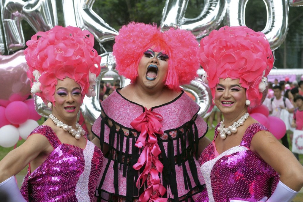 Participants dress up for the annual “Pink Dot” event in Singapore in 2015. The rally has been held every year since 2009 in support of LGBT rights. Photo: AFP