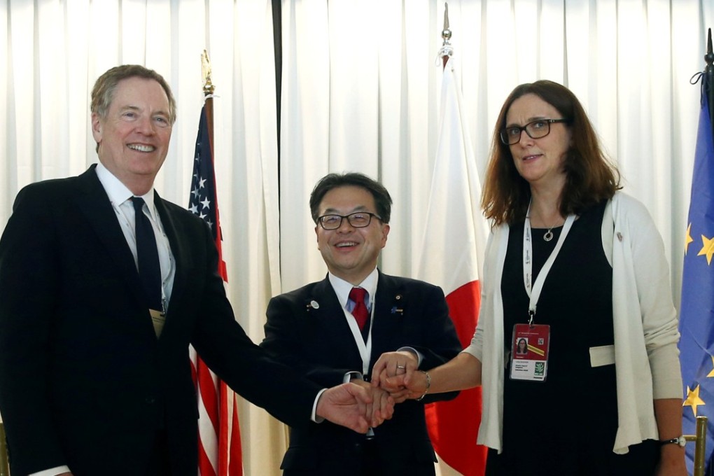 US Trade Representative Robert Lighthizer (left), Japan's economy, trade and industry minister Hiroshige Seko (centre) and European Commissioner for Trade, Cecilia Malmstrom pose for a photograph during the WTO ministerial conference in Buenos Aires. Photo: Reuters