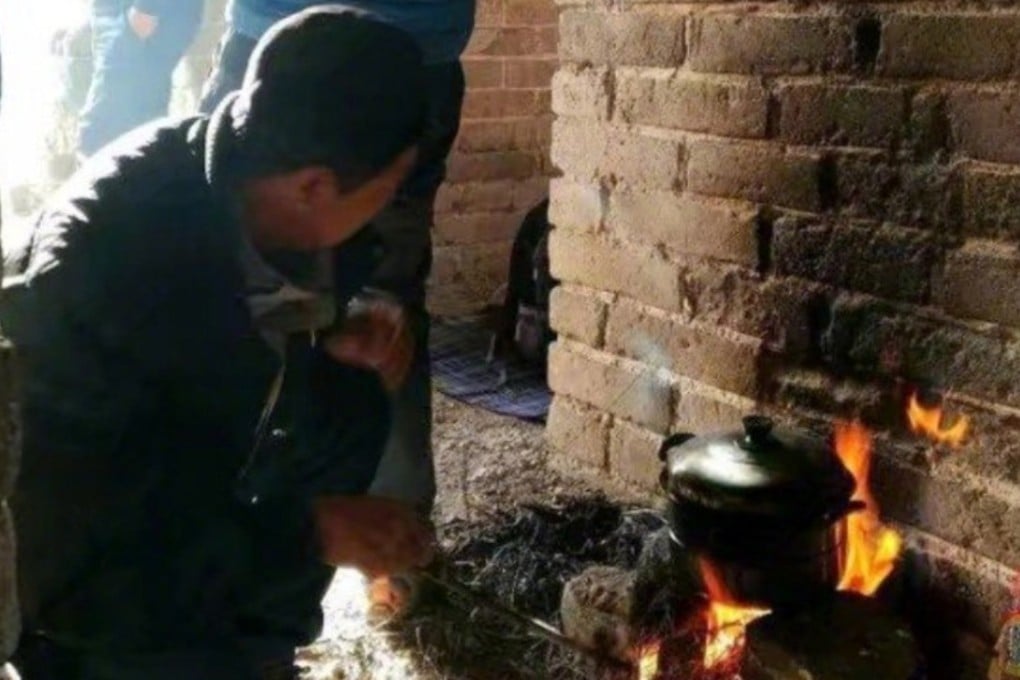 The visitors were spotted building a fire to heat a cooking pot. Photo: Weibo.