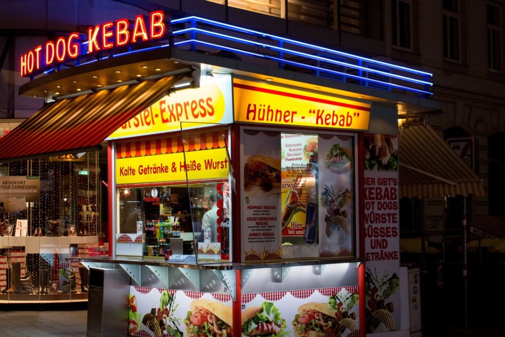 A wurst stand offers hot dogs and kebab in Vienna, Austria. A tax on meat to curb emissions contributing to global warming may be coming. Photo: EPA-EFE