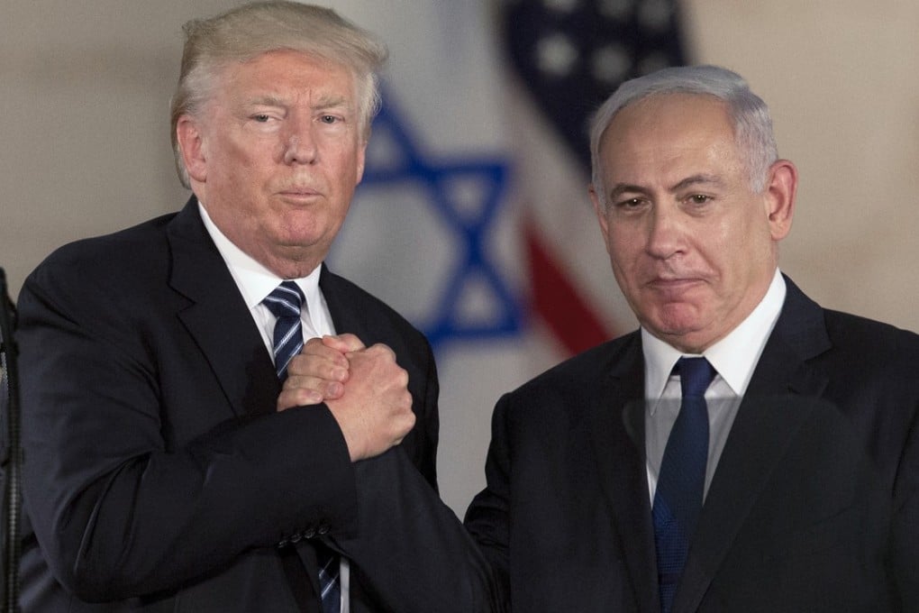 US President Donald Trump and Israeli Prime Minister Benjamin Netanyahu shake hands in Jerusalem in May. Photo: AP