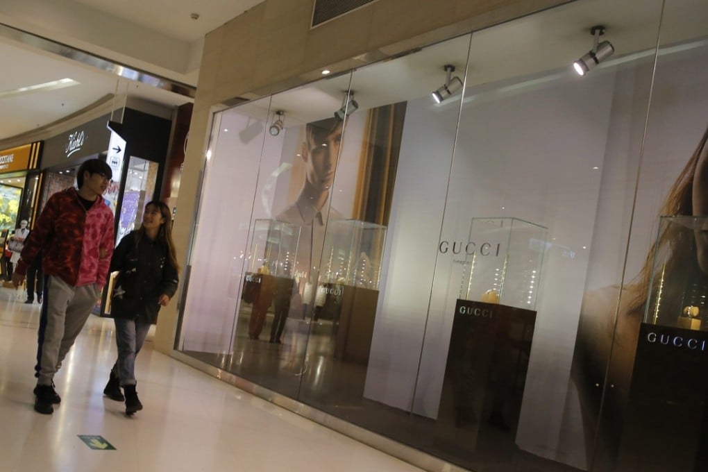 A luxury goods store in a shopping centre in Beijing. A survey found that young Chinese born after 1985 plan to continue spending on high-end goods in 2018, even as economic growth is predicted to slow. Photo: EPA